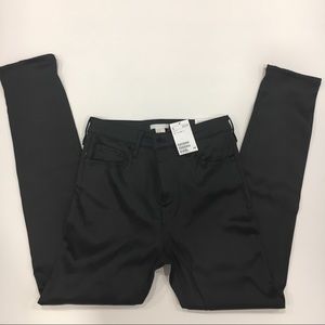 Wax-coated black skinny jeans